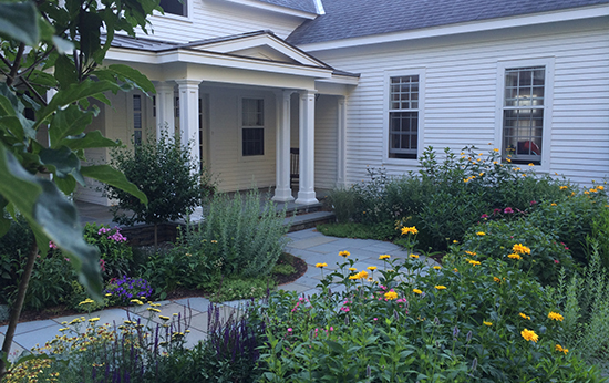 Photo of home front entrance with flowers